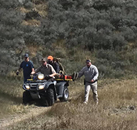 Rescue workers carrying Coy Kummer on an ATV