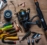 Assortment of fishing equipment, including a rod, reel and lures