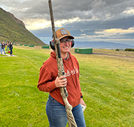 Female shooter with a shotgun at the Spanish Fork Gun Club outdoor shooting range