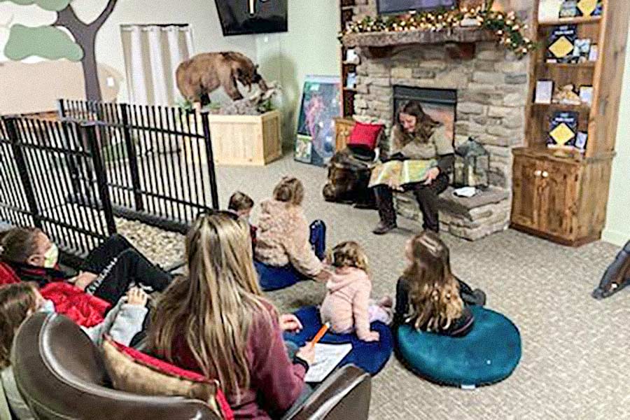 Woman reading a story to children at the Wildlife Education Center at Hardware WMA