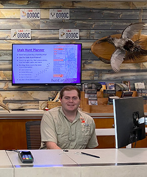 Utah Division of Wildlife Resources employee sitting at the front desk