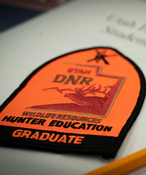 Utah Hunter Education graduate arm patch on paper